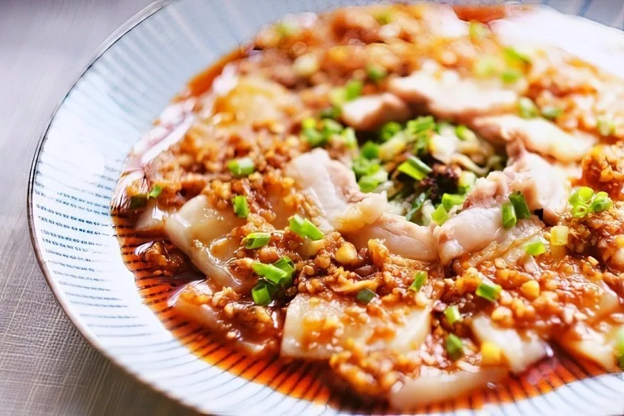 Pork slices with garlic sauce served as a cold appetizer