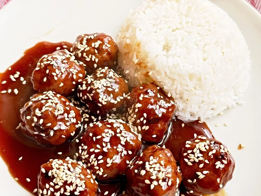Meatballs coated in sweet and sour sauce
