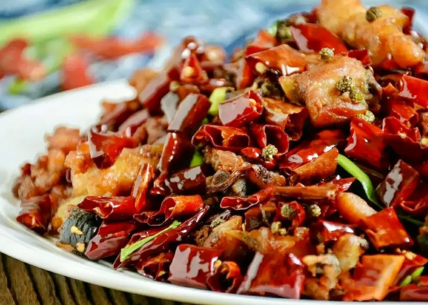 Crispy chicken pieces tossed with chilies and Sichuan pepper