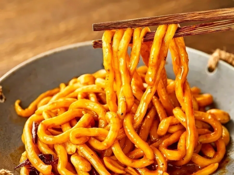 Thick sweet water noodles with chili oil and sesame