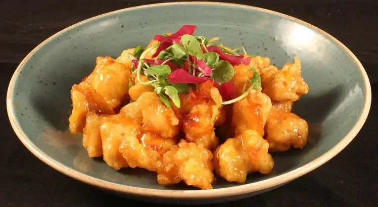 Sweet and sour chicken served on a plate