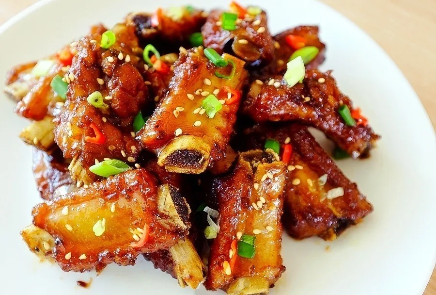 Sweet and sour pork ribs with sesame seeds